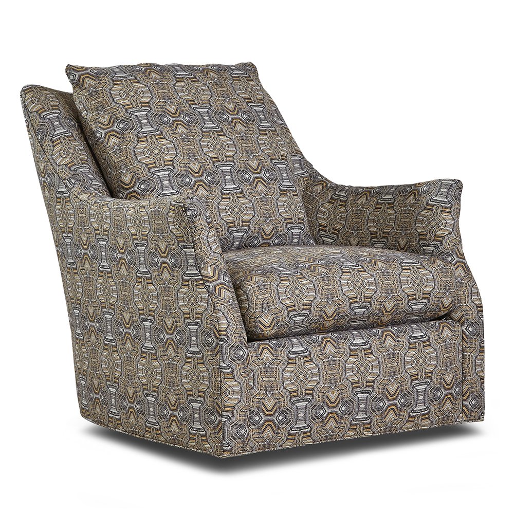 A Huntington House swivel glider with flared arms and a loose back pillow, upholstered in a gray and gold geometric print.