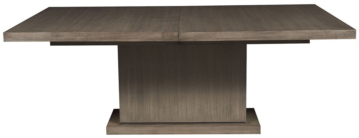 The Vanguard Bradford rectangular dining table in Greythorne, a gray-brown wood top on a broad rectangular pedestal base.