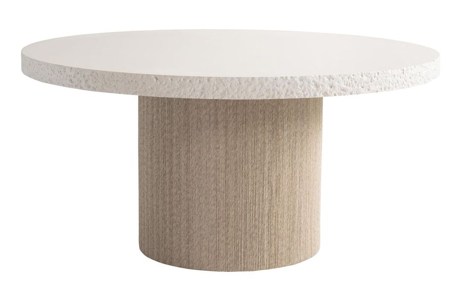 The Bernhardt Kiona round dining table: a textured ivory top on a fluted drum pedestal.