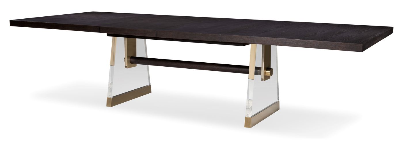 The Century Cadence dining table: a dark oak top on a trestle base with clear acrylic legs and brass accents.