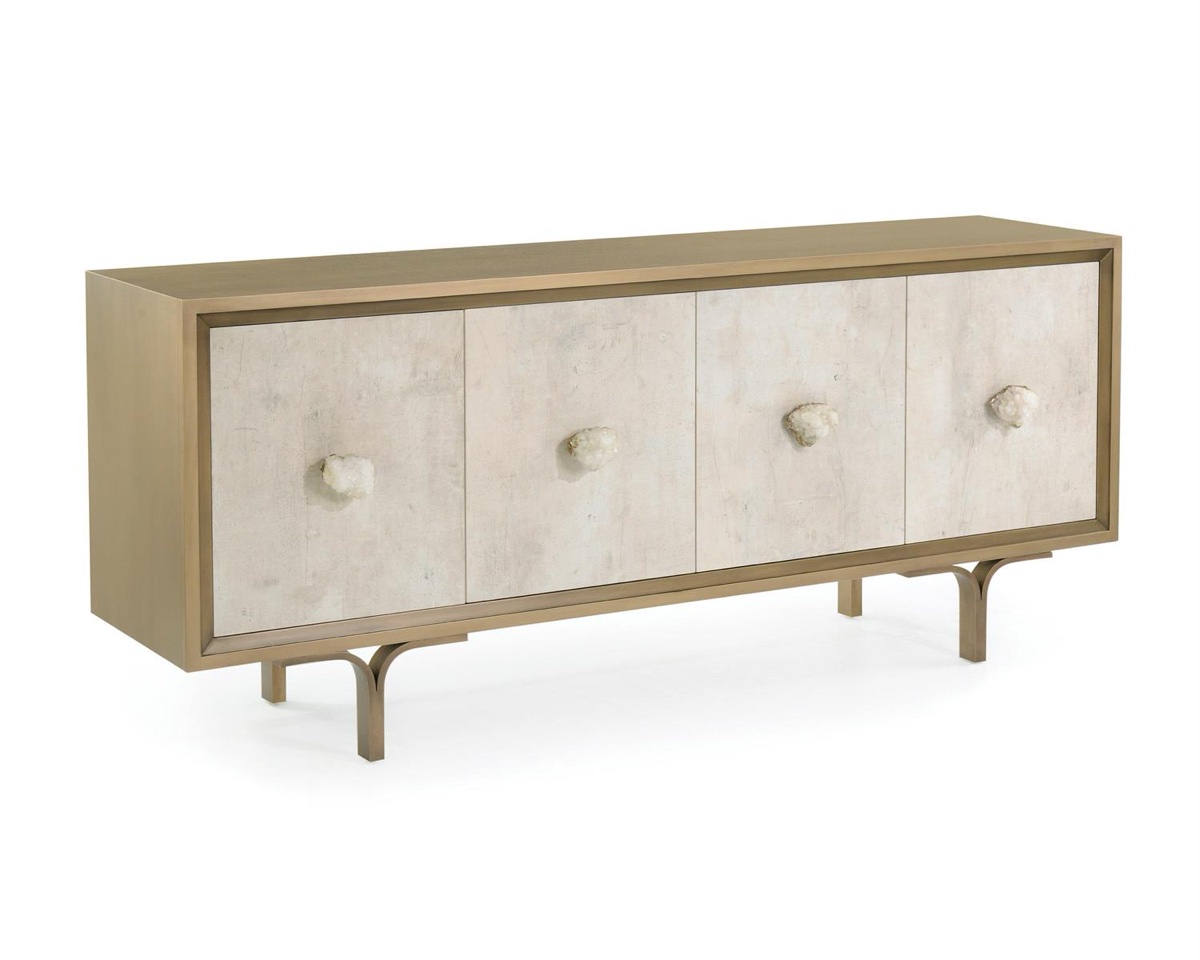 The Belgrave four-door sideboard by John-Richard, pale doors with rough quartz pulls in a brass case, the kind of piece that greets you in an entry.