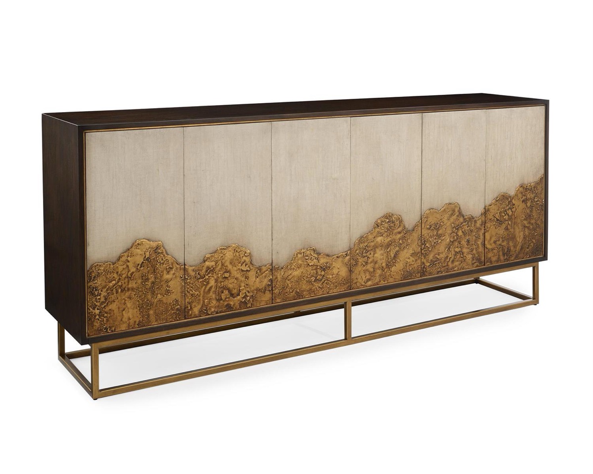 The Highlands six-door sideboard by John-Richard, a molten-gold horizon across its cream doors, standing at a grand serving height.