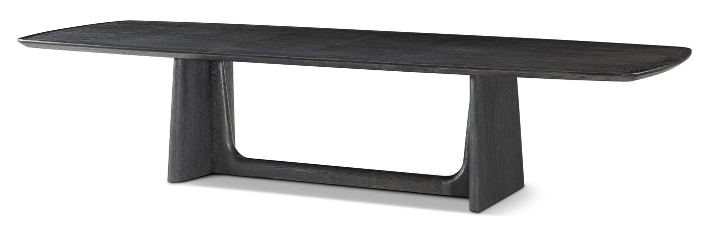 The Theodore Alexander Repose dining table in charcoal oak, shown fully extended on a sculpted base.
