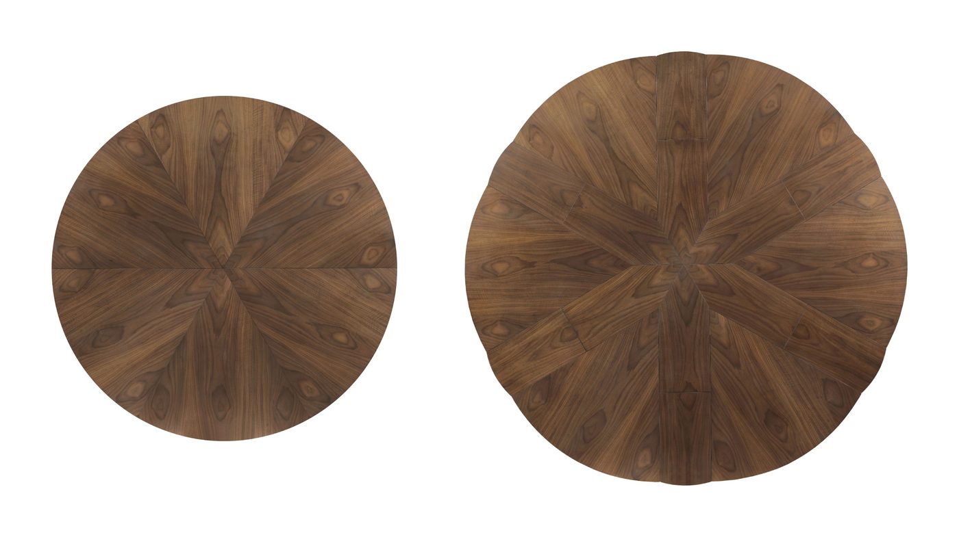 The Woodbridge Rawlins jupe table seen from above, closed as a walnut round with radiating seams, and open with six leaves set between its six segments.